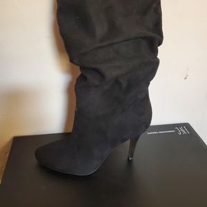 Black sleek high heeled boots by International